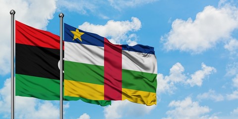 Libya and Central African Republic flag waving in the wind against white cloudy blue sky together. Diplomacy concept, international relations.
