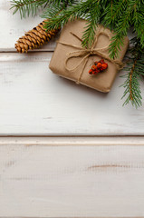 Christmas gifts with fir tree branches on white background
