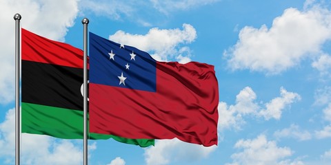 Libya and Samoa flag waving in the wind against white cloudy blue sky together. Diplomacy concept,...