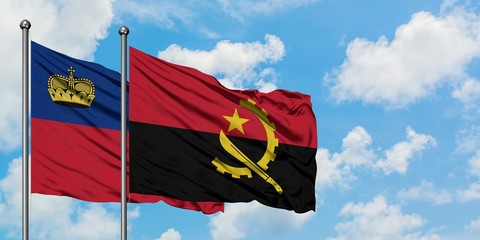 Liechtenstein and Angola flag waving in the wind against white cloudy blue sky together. Diplomacy concept, international relations.