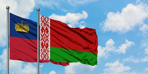 Liechtenstein and Belarus flag waving in the wind against white cloudy blue sky together. Diplomacy concept, international relations.