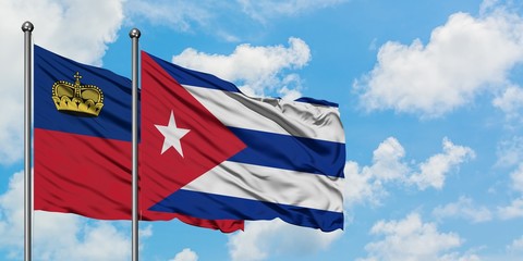 Liechtenstein and Cuba flag waving in the wind against white cloudy blue sky together. Diplomacy concept, international relations.