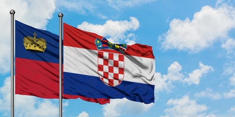 Liechtenstein and Croatia flag waving in the wind against white cloudy blue sky together. Diplomacy concept, international relations.