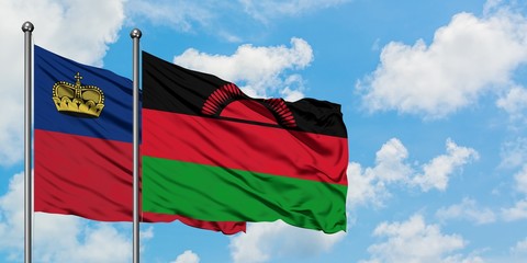 Liechtenstein and Malawi flag waving in the wind against white cloudy blue sky together. Diplomacy concept, international relations.