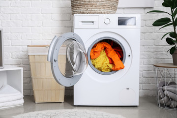 Interior of home laundry room with modern washing machine
