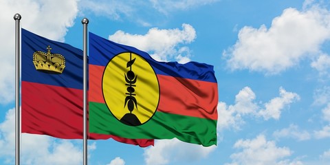 Liechtenstein and New Caledonia flag waving in the wind against white cloudy blue sky together. Diplomacy concept, international relations.