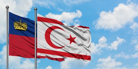 Liechtenstein and Northern Cyprus flag waving in the wind against white cloudy blue sky together. Diplomacy concept, international relations.
