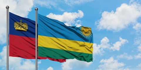 Liechtenstein and Rwanda flag waving in the wind against white cloudy blue sky together. Diplomacy concept, international relations.