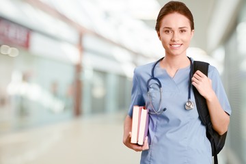 Nurse student with books and stethoscope