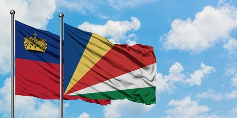 Liechtenstein and Seychelles flag waving in the wind against white cloudy blue sky together. Diplomacy concept, international relations.