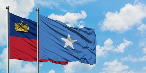 Liechtenstein and Somalia flag waving in the wind against white cloudy blue sky together. Diplomacy concept, international relations.