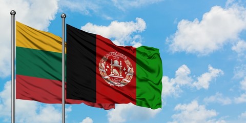 Lithuania and Afghanistan flag waving in the wind against white cloudy blue sky together. Diplomacy concept, international relations.