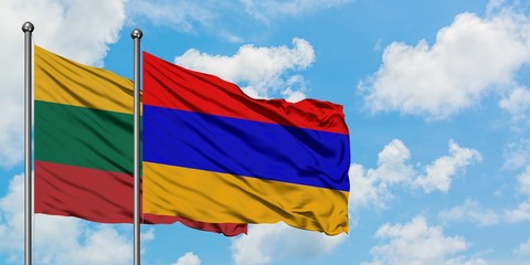 Lithuania and Armenia flag waving in the wind against white cloudy blue sky together. Diplomacy concept, international relations.