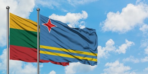 Lithuania and Aruba flag waving in the wind against white cloudy blue sky together. Diplomacy concept, international relations.