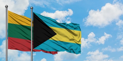 Lithuania and Bahamas flag waving in the wind against white cloudy blue sky together. Diplomacy concept, international relations.