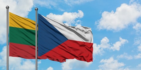 Lithuania and Czech Republic flag waving in the wind against white cloudy blue sky together. Diplomacy concept, international relations.