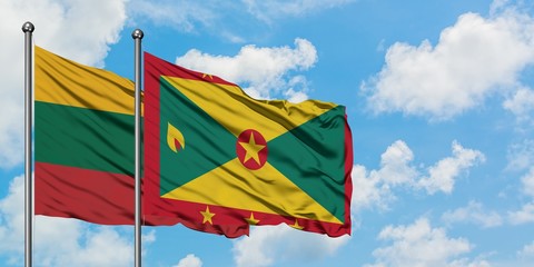 Lithuania and Grenada flag waving in the wind against white cloudy blue sky together. Diplomacy concept, international relations.
