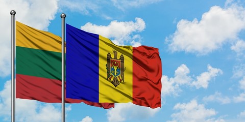 Lithuania and Moldova flag waving in the wind against white cloudy blue sky together. Diplomacy concept, international relations.