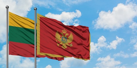 Lithuania and Montenegro flag waving in the wind against white cloudy blue sky together. Diplomacy concept, international relations.