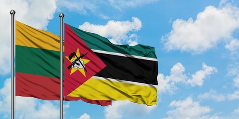 Lithuania and Mozambique flag waving in the wind against white cloudy blue sky together. Diplomacy concept, international relations.