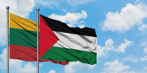 Lithuania and Palestine flag waving in the wind against white cloudy blue sky together. Diplomacy concept, international relations.