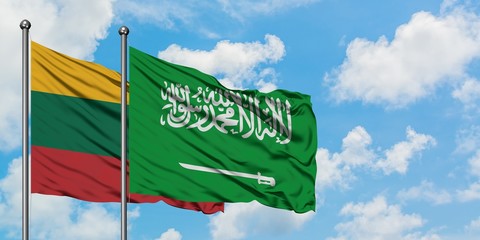 Lithuania and Saudi Arabia flag waving in the wind against white cloudy blue sky together. Diplomacy concept, international relations.