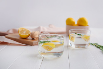 Glasses of fresh lemonade on table