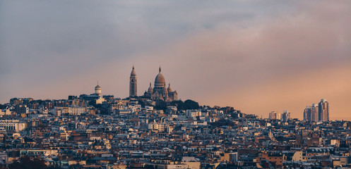 Panoramic view from the Arc de Triomphe, The Basilica of Sacred Heart at Montmartre. France. Famous touristic places in Europe. European city travel concept.