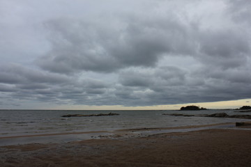 Fototapeta premium Shore of Lake Vanern on a cloudy and windy autumn day.