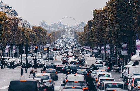 Paris, France - Nov 27, 2013: View of Champs Elysees street. The street is one of the most expensive strips in the world.Famous touristic places in Europe. European city travel concept.