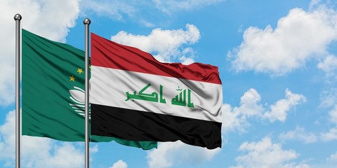 Macao and Iraq flag waving in the wind against white cloudy blue sky together. Diplomacy concept, international relations.