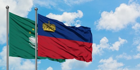 Macao and Liechtenstein flag waving in the wind against white cloudy blue sky together. Diplomacy concept, international relations.
