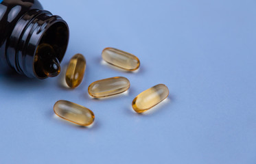 Brown gel capsule pills spread out of drug bottle. Antipsychotic drug. Capsule medicine for treatment depression. Anti-anxiety. Drug. Global healthcare