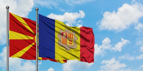 Macedonia and Andorra flag waving in the wind against white cloudy blue sky together. Diplomacy concept, international relations.