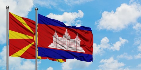 Macedonia and Cambodia flag waving in the wind against white cloudy blue sky together. Diplomacy concept, international relations.