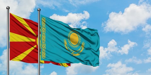 Macedonia and Kazakhstan flag waving in the wind against white cloudy blue sky together. Diplomacy concept, international relations.
