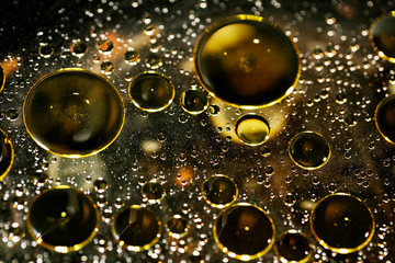 Golden oil bubbles macro on water black background with bokeh fifty megapixels prints