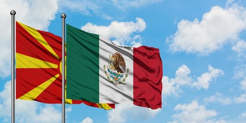 Macedonia and Mexico flag waving in the wind against white cloudy blue sky together. Diplomacy concept, international relations.