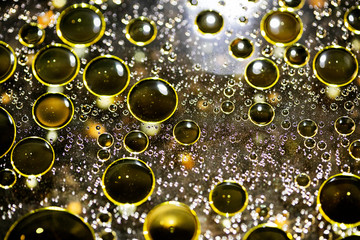 Golden oil bubbles macro on water black background with bokeh fifty megapixels prints