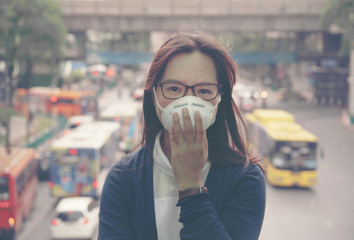 woman wearing protective mask in the city street