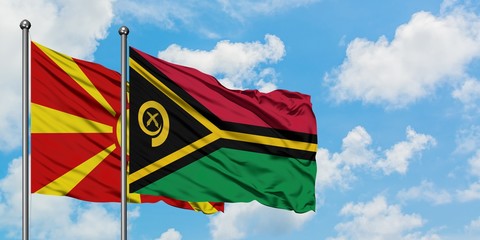 Macedonia and Vanuatu flag waving in the wind against white cloudy blue sky together. Diplomacy concept, international relations.