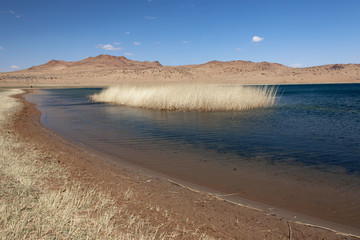 Cloudy sunset on a mountain lake. Mongolia