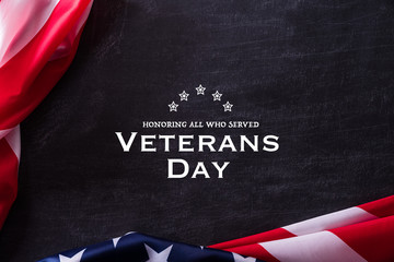 Fototapeta na wymiar Happy Veterans Day. American flags veterans against a blackboard background.