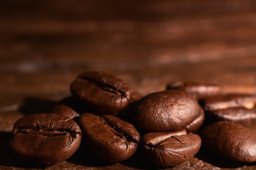 coffee background of roasted coffee beans on wooden background