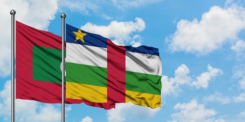 Maldives and Central African Republic flag waving in the wind against white cloudy blue sky together. Diplomacy concept, international relations.