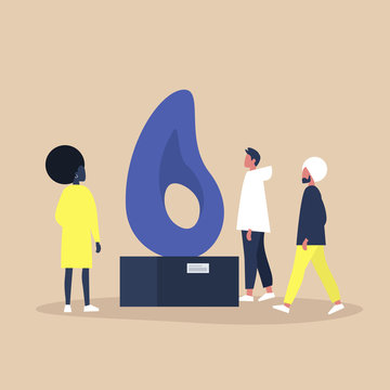 A group of people standing and walking around a contemporary public art installation