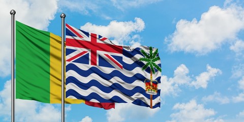 Mali and British Indian Ocean Territory flag waving in the wind against white cloudy blue sky together. Diplomacy concept, international relations.