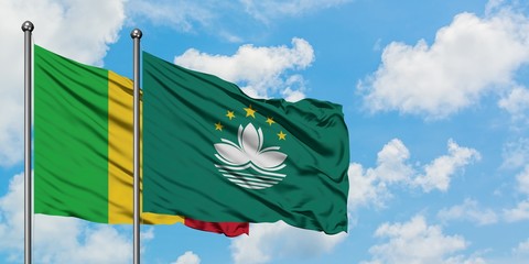 Mali and Macao flag waving in the wind against white cloudy blue sky together. Diplomacy concept, international relations.