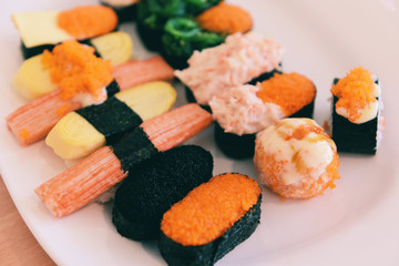 Japanese food sushi roll rice with Tobiko egg Red caviar Cream sauce nori seaweed in the restaurant sashimi sushi menu set Japanese cuisine fresh ingredients mix various types