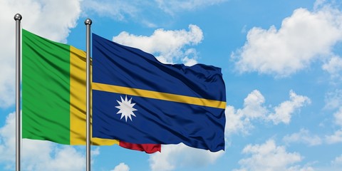 Mali and Nauru flag waving in the wind against white cloudy blue sky together. Diplomacy concept,...